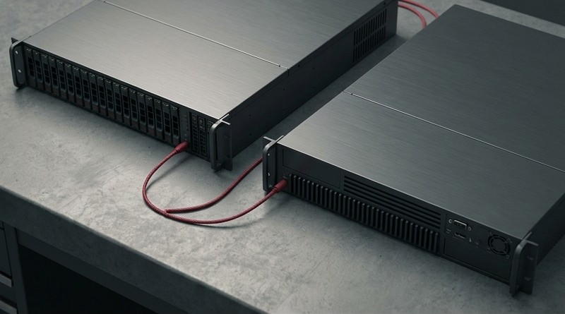Conceptual AI illustration: Two charcoal servers linked by a crimson cable.