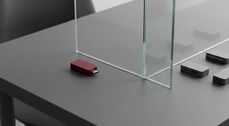 Conceptual AI illustration: A chosen crimson module separated from other modules by glass.